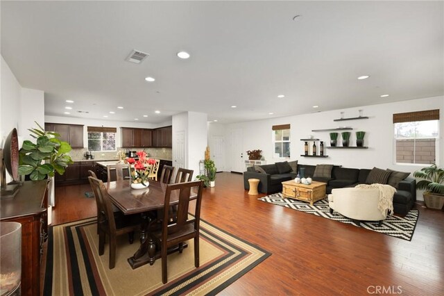 dining area featuring recessed lighting, visible vents, a wealth of natural light, and wood finished floors