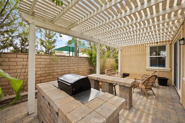 view of patio featuring area for grilling and a fenced backyard