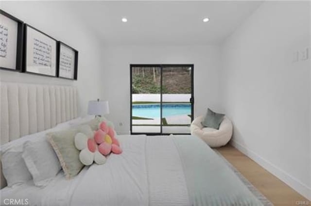 bedroom featuring recessed lighting, baseboards, and wood finished floors