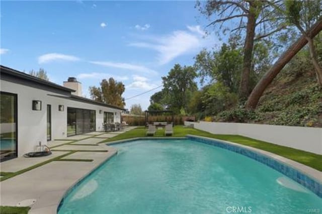 view of pool with a patio and a fenced in pool