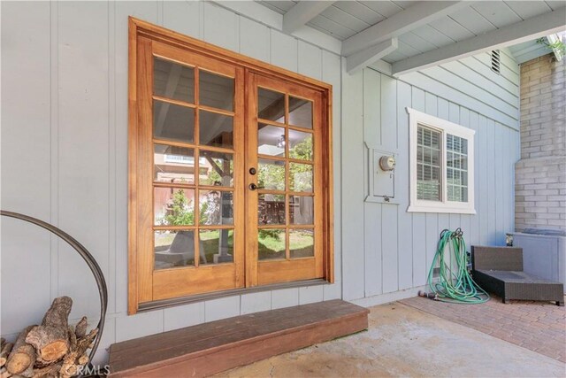 entrance to property with french doors and a patio area