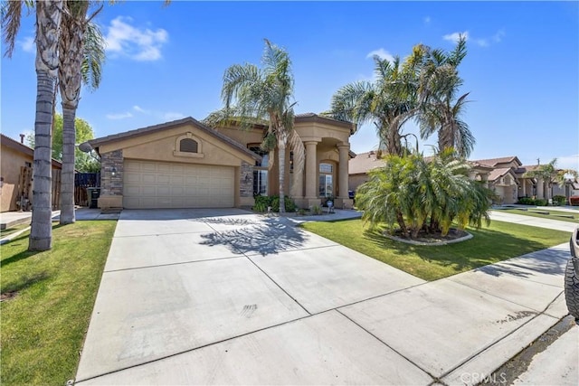 mediterranean / spanish-style house featuring stucco siding, an attached garage, driveway, and a front yard