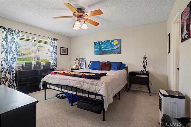 bedroom with light colored carpet, a textured ceiling, and ceiling fan