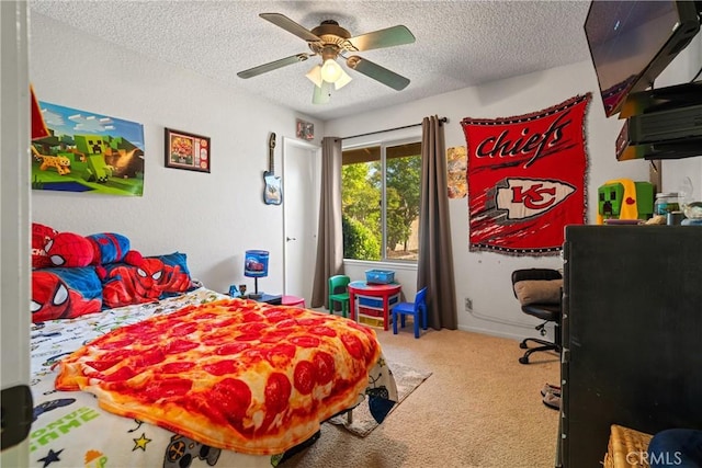bedroom with carpet flooring, a textured ceiling, and ceiling fan