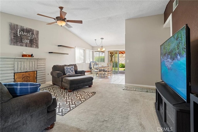 carpeted living area featuring a textured ceiling, visible vents, a fireplace, ceiling fan with notable chandelier, and lofted ceiling