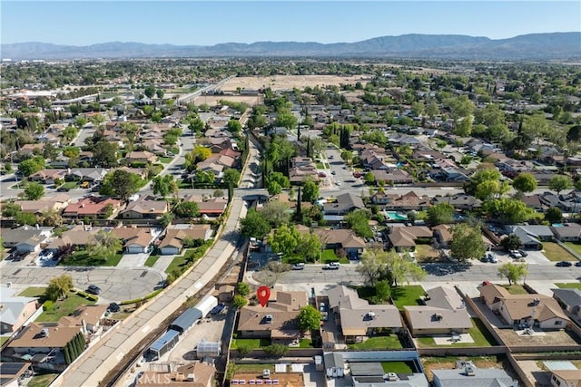 drone / aerial view with a mountain view and a residential view