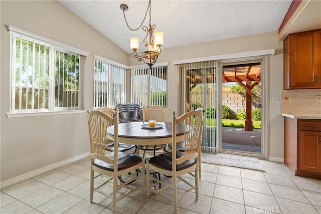 2303 Dallin St, Lancaster, CA 93536 - dining room with plenty of natural light, a textured ceiling, and a notable chandelier