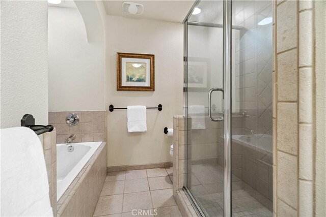 full bath with a bath, visible vents, a shower stall, tile patterned floors, and baseboards