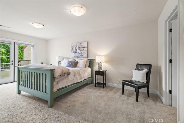 bedroom with carpet flooring, access to exterior, french doors, baseboards, and visible vents