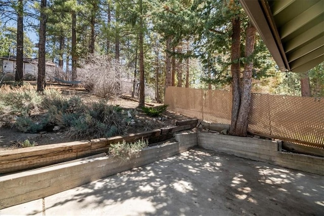 view of patio / terrace featuring fence