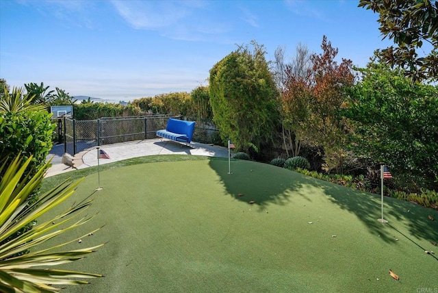 view of yard featuring fence and a patio area