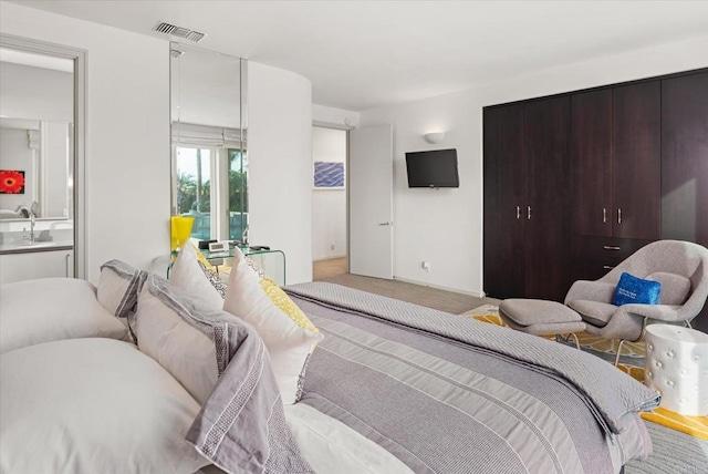 bedroom featuring visible vents and carpet