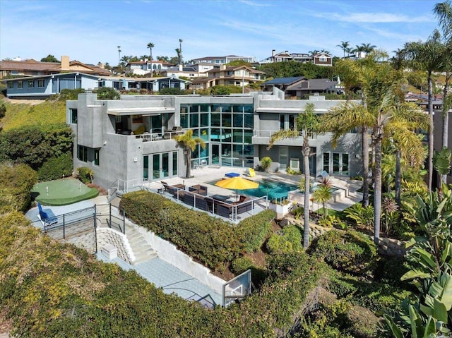 back of property featuring a residential view