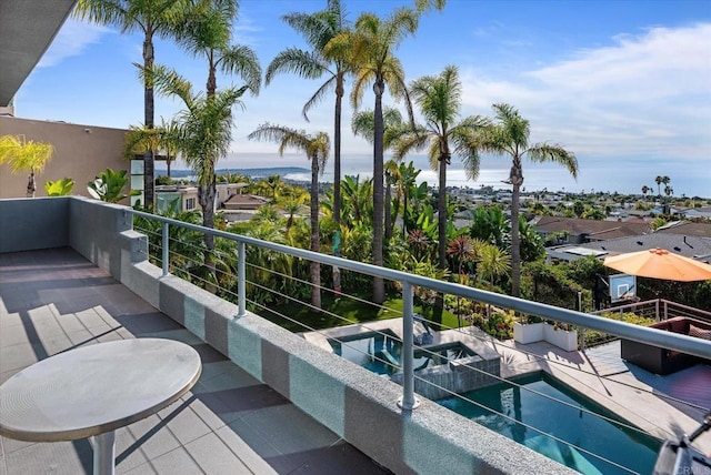 balcony with an in ground hot tub