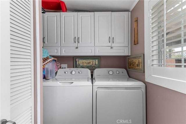 laundry area with cabinet space and washer and dryer