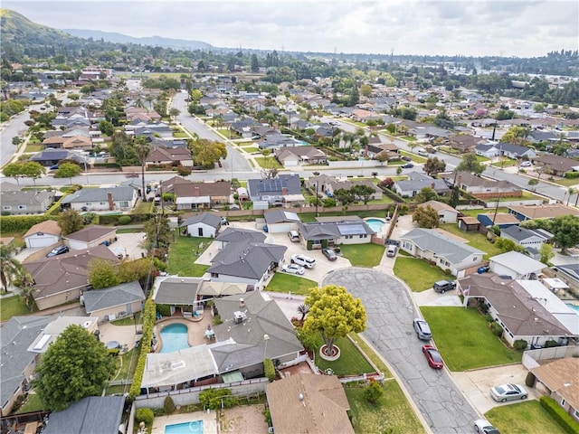 drone / aerial view with a residential view and a mountain view
