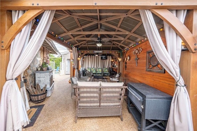 view of patio / terrace featuring a gazebo, an outdoor living space, and a ceiling fan