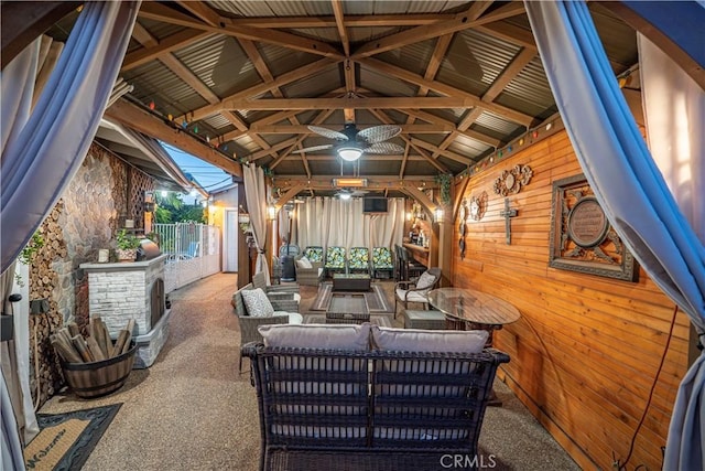 view of patio featuring a gazebo, outdoor lounge area, and fence