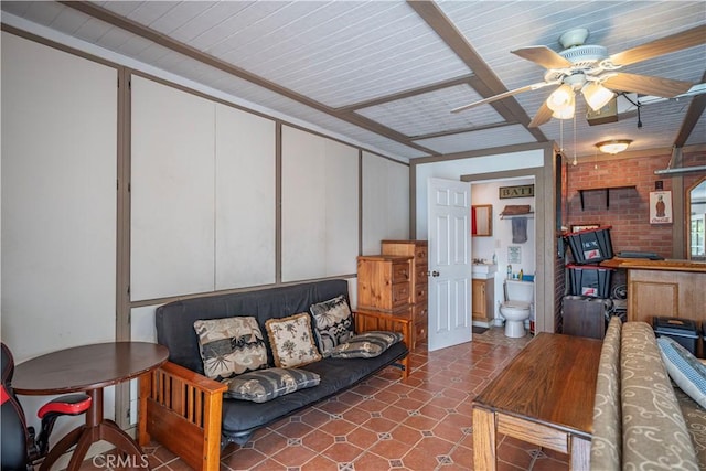 living area with a ceiling fan