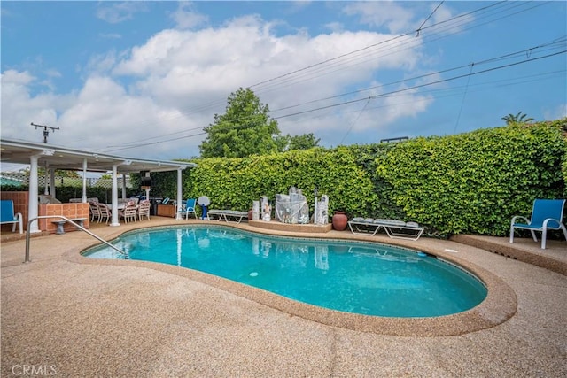 view of swimming pool with a fenced in pool, a patio area, and fence