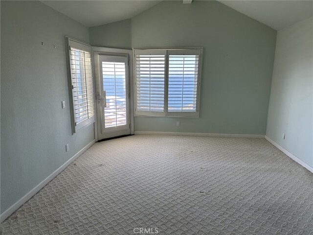 17 Marseille, Laguna Niguel, CA 92677 - spare room featuring carpet floors, baseboards, and lofted ceiling