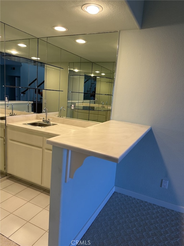 17 Marseille, Laguna Niguel, CA 92677 - interior space featuring baseboards, a sink, white cabinetry, and light countertops