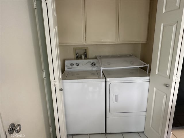 17 Marseille, Laguna Niguel, CA 92677 - laundry room featuring light tile patterned flooring, cabinet space, and washer and clothes dryer