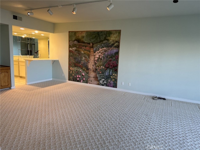 17 Marseille, Laguna Niguel, CA 92677 - unfurnished bedroom featuring visible vents, rail lighting, and light colored carpet