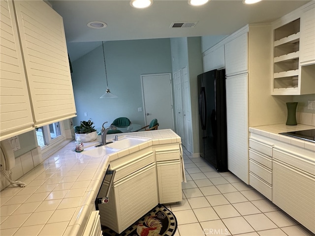 17 Marseille, Laguna Niguel, CA 92677 - kitchen featuring tile countertops, a sink, light tile patterned floors, freestanding refrigerator, and a peninsula