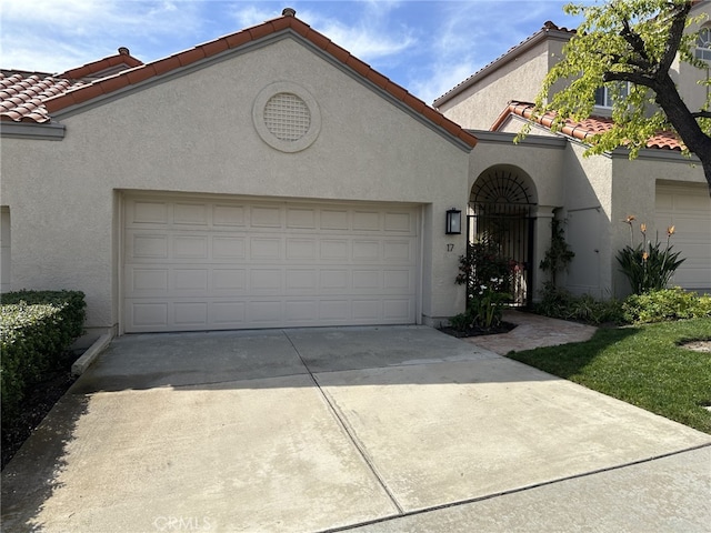 17 Marseille, Laguna Niguel, CA 92677 - mediterranean / spanish-style home with a tiled roof, a garage, concrete driveway, and stucco siding