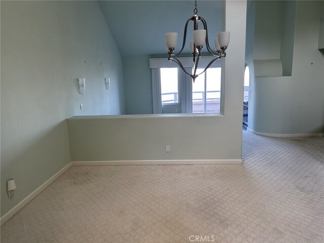 17 Marseille, Laguna Niguel, CA 92677 - interior space featuring an inviting chandelier, baseboards, vaulted ceiling, and carpet flooring