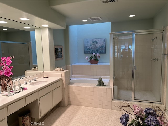 17 Marseille, Laguna Niguel, CA 92677 - full bath featuring visible vents, recessed lighting, a bath, and a shower stall