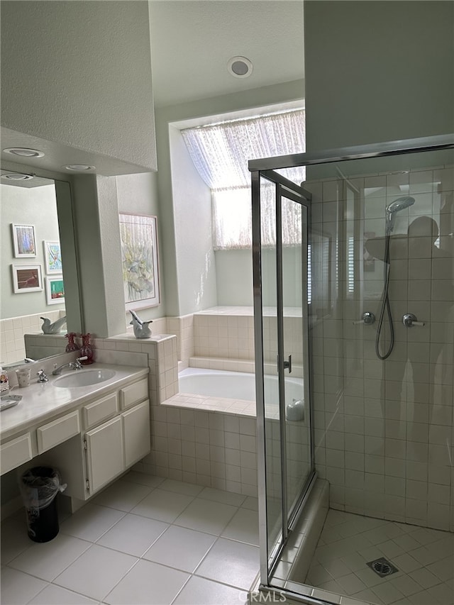 17 Marseille, Laguna Niguel, CA 92677 - full bath with a bath, a shower stall, tile patterned flooring, and vanity