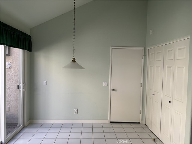 17 Marseille, Laguna Niguel, CA 92677 - unfurnished dining area with baseboards, high vaulted ceiling, and light tile patterned flooring