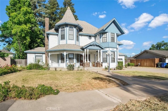 3716 Viader Dr, Modesto, CA 95356 - victorian home with a chimney, a porch, concrete driveway, and a shingled roof