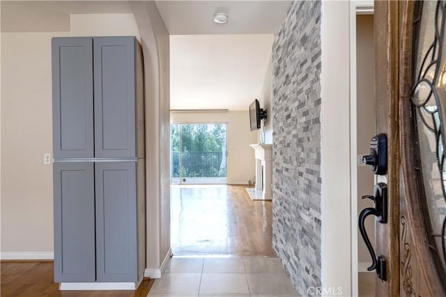 11449 Tampa Ave Unit 139, Porter Ranch, CA 91326 - hall featuring baseboards and light wood finished floors
