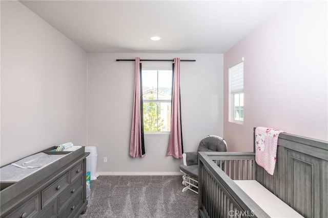 bedroom featuring dark colored carpet, recessed lighting, and baseboards