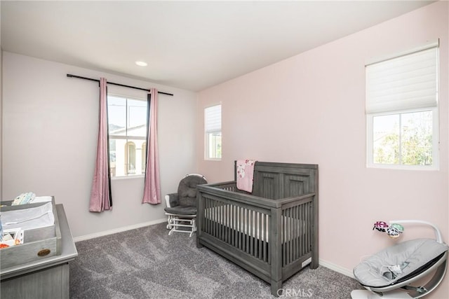 bedroom featuring baseboards and carpet flooring