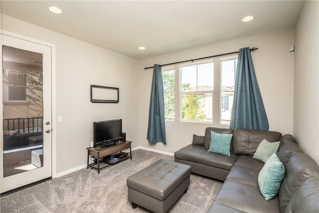 living area featuring carpet floors, baseboards, and recessed lighting