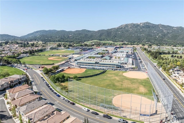drone / aerial view featuring a residential view and a mountain view