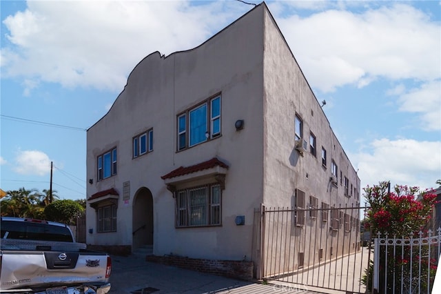 432 N Virgil Ave, Los Angeles, CA 90004 - mediterranean / spanish house with fence, a gate, and stucco siding