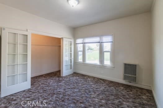 432 N Virgil Ave, Los Angeles, CA 90004 - unfurnished bedroom featuring carpet floors, baseboards, and a closet