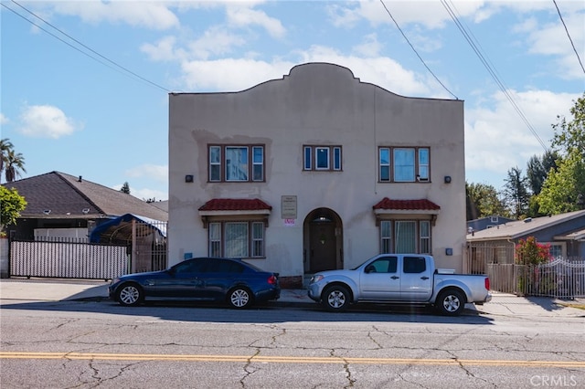 432 N Virgil Ave, Los Angeles, CA 90004 - mediterranean / spanish-style house with fence and stucco siding