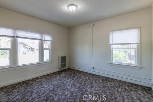432 N Virgil Ave, Los Angeles, CA 90004 - unfurnished room featuring carpet flooring, baseboards, and heating unit