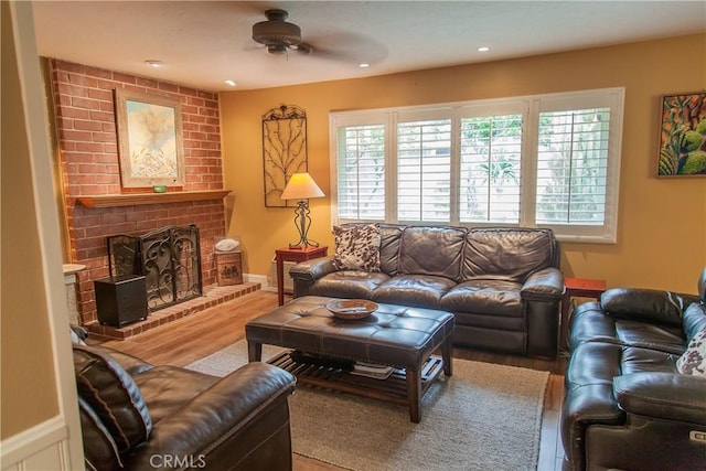 3139 E Chapman Ave Unit 14A, Orange, CA 92869 - living area with ceiling fan, wood finished floors, a brick fireplace, and recessed lighting