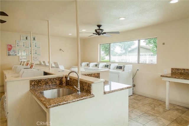 3139 E Chapman Ave Unit 14A, Orange, CA 92869 - kitchen featuring washer and dryer, a sink, a ceiling fan, light stone countertops, and recessed lighting