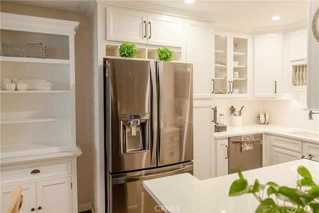 3139 E Chapman Ave Unit 14A, Orange, CA 92869 - kitchen with stainless steel appliances, white cabinetry, light countertops, a sink, and recessed lighting