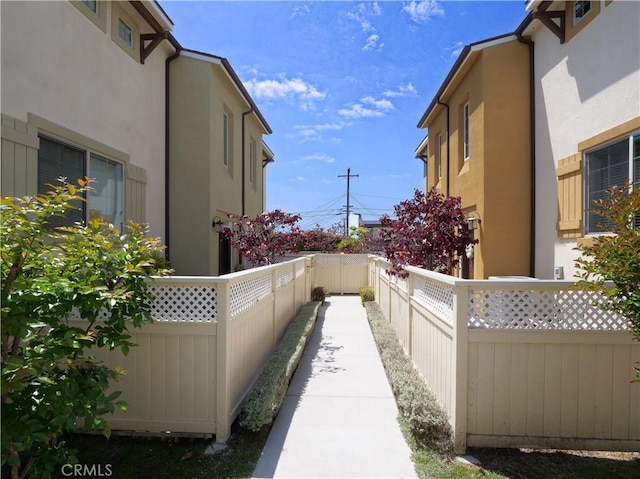 view of home's exterior with a fenced backyard and stucco siding