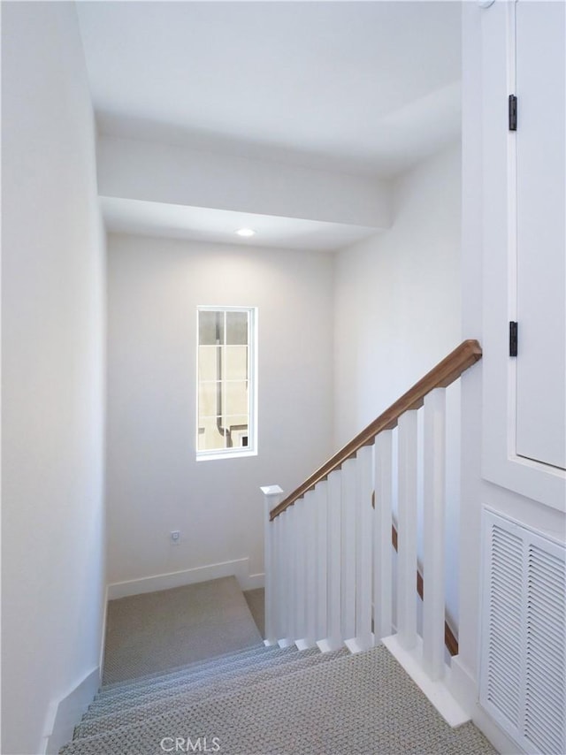 stairs featuring baseboards, carpet flooring, and visible vents