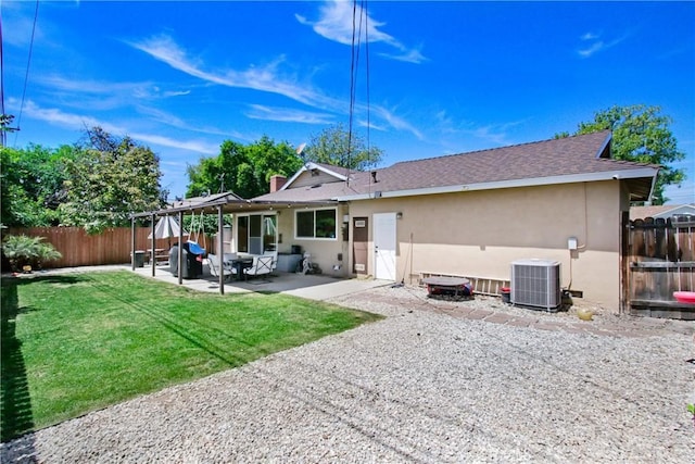 back of house featuring central air condition unit, a fenced backyard, a patio area, and stucco siding